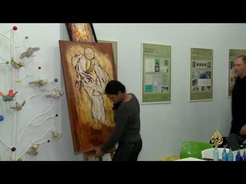 بالفيديو الرسم يجمع ثقافات العالم في مدينة الدوحة