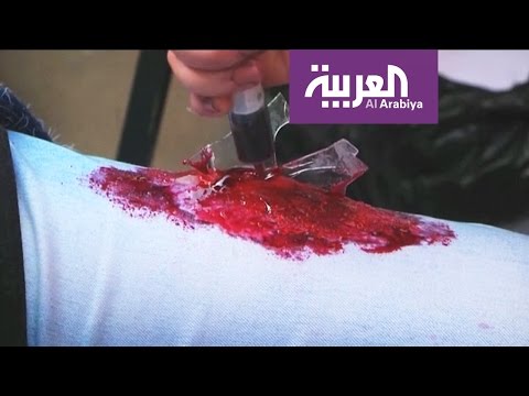 بالفيديو فنانة فلسطينية تحوّل واقع قطاع غزة إلى لوحات بشرية