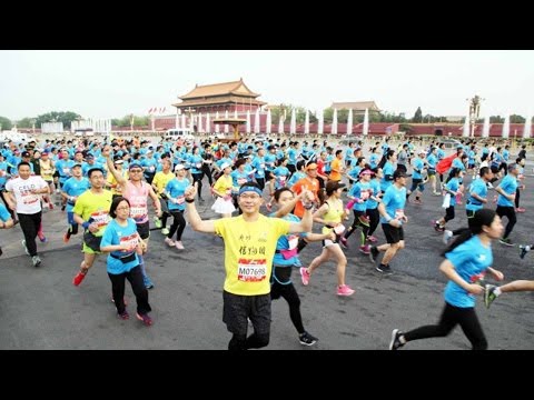 شاهد منافسات الجري تضم 21 ألف شخص في بكين