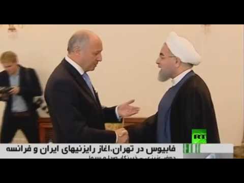 شاهد لحظة اللقاء بين حسن روحاني ولوران فابيوس