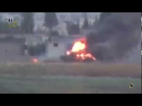 شاهد  احتراق دبابة للنظام السوري بصاروخ في سهل الغاب