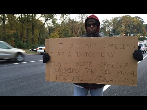 شاهد شرطي يتخفى لاصطياد مستخدمي الهاتف أثناء القيادة