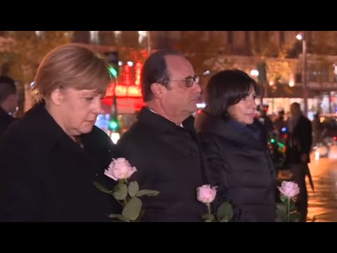 شاهد أنجيلا ميركل تضع وردة حزنًا على ضحايا باريس