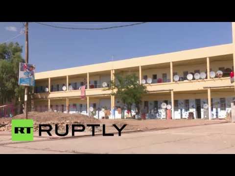 شاهد سوريون يلجؤون لأحد معتقلات صدام