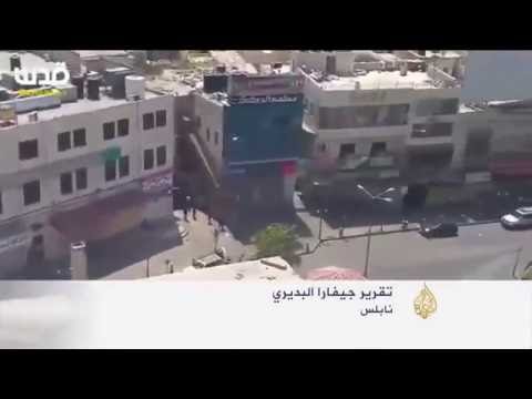 شاهد قوات الأمن تعزز انتشارها في مدينة نابلس بعد مقتل الشاب المعتقل أحمد حلاوة