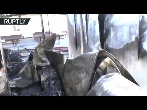 بالفيديو لاجئون غاضبون يحرقون مستودعات داخل مركز لإيوائهم