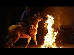 horses gallop through bonfires at spanish festival
