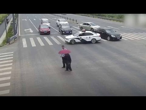 policeman stop traffic with car