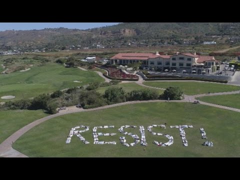 activists spell out resist on trump