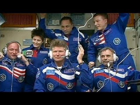 launch of new crew to iss delayed by 2 months