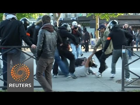 protesters clash with police at paris may day marches
