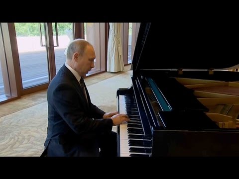 putin surprises with impromptu piano