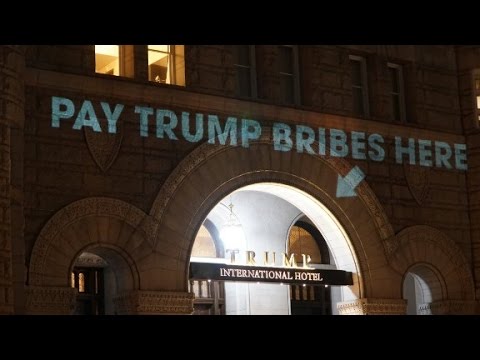 pay bribes here sign projected