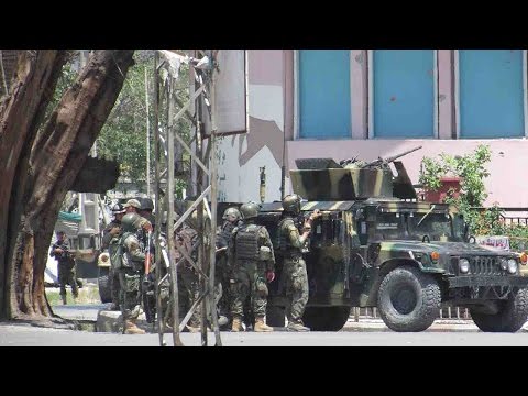 three killed and dozens wounded in bank attack