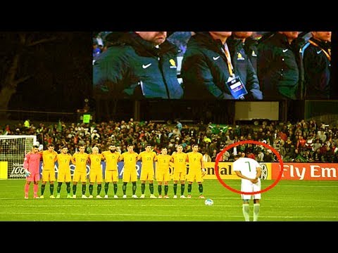 saudi arabian midfielder salman alfaraj stands respectfully