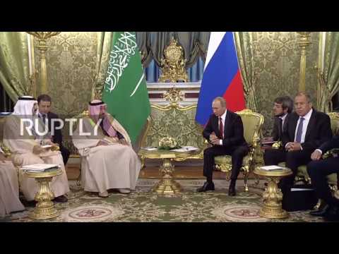 saudi king greeted by putin in historic first