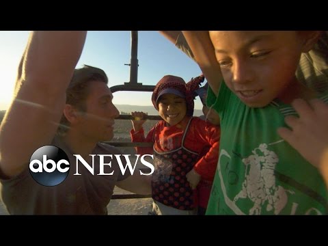 child refugees are working in the fields picking crops